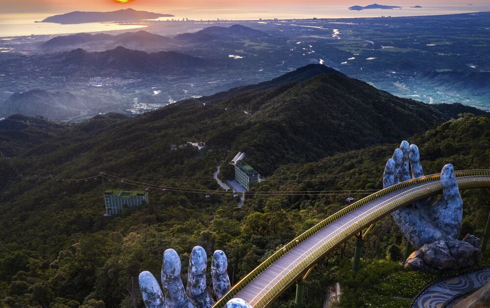Golden Bridge at Ba Na Hills held by giant stone hands