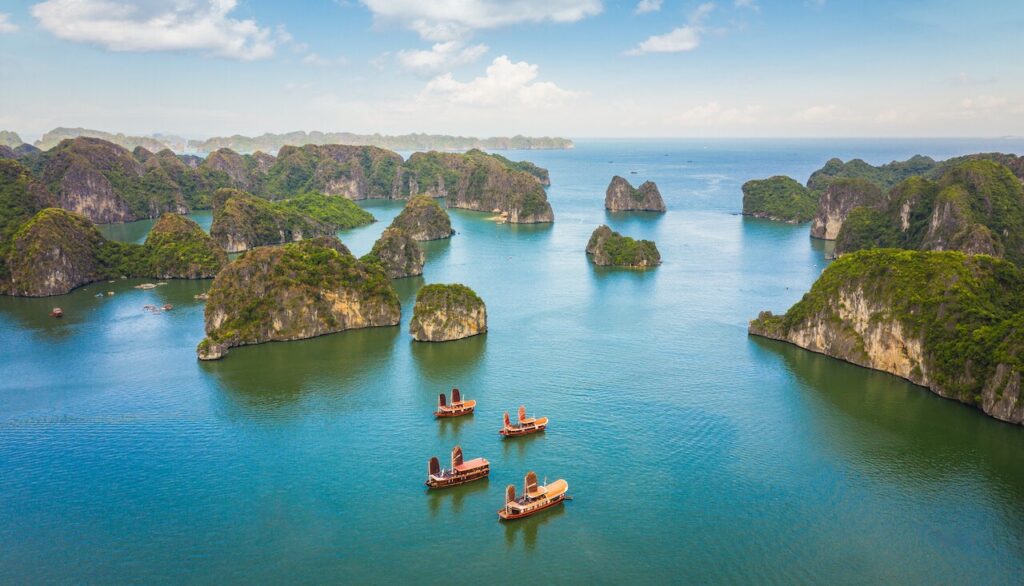 Lan Ha Bay aerial view limestone karst islands junk boats