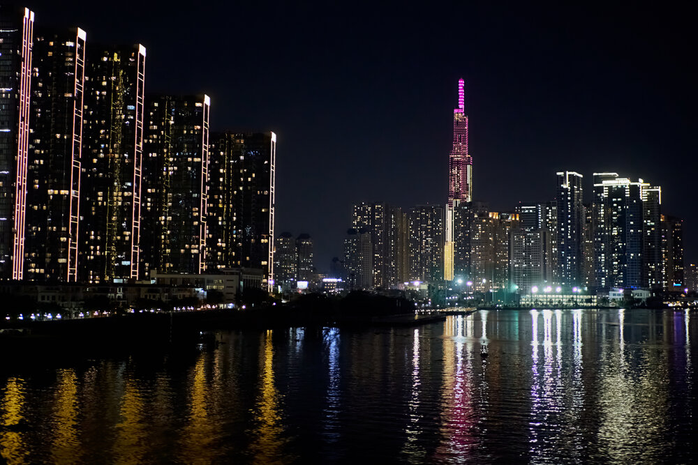 Ho Chi Minh City skyline and Saigon River at night