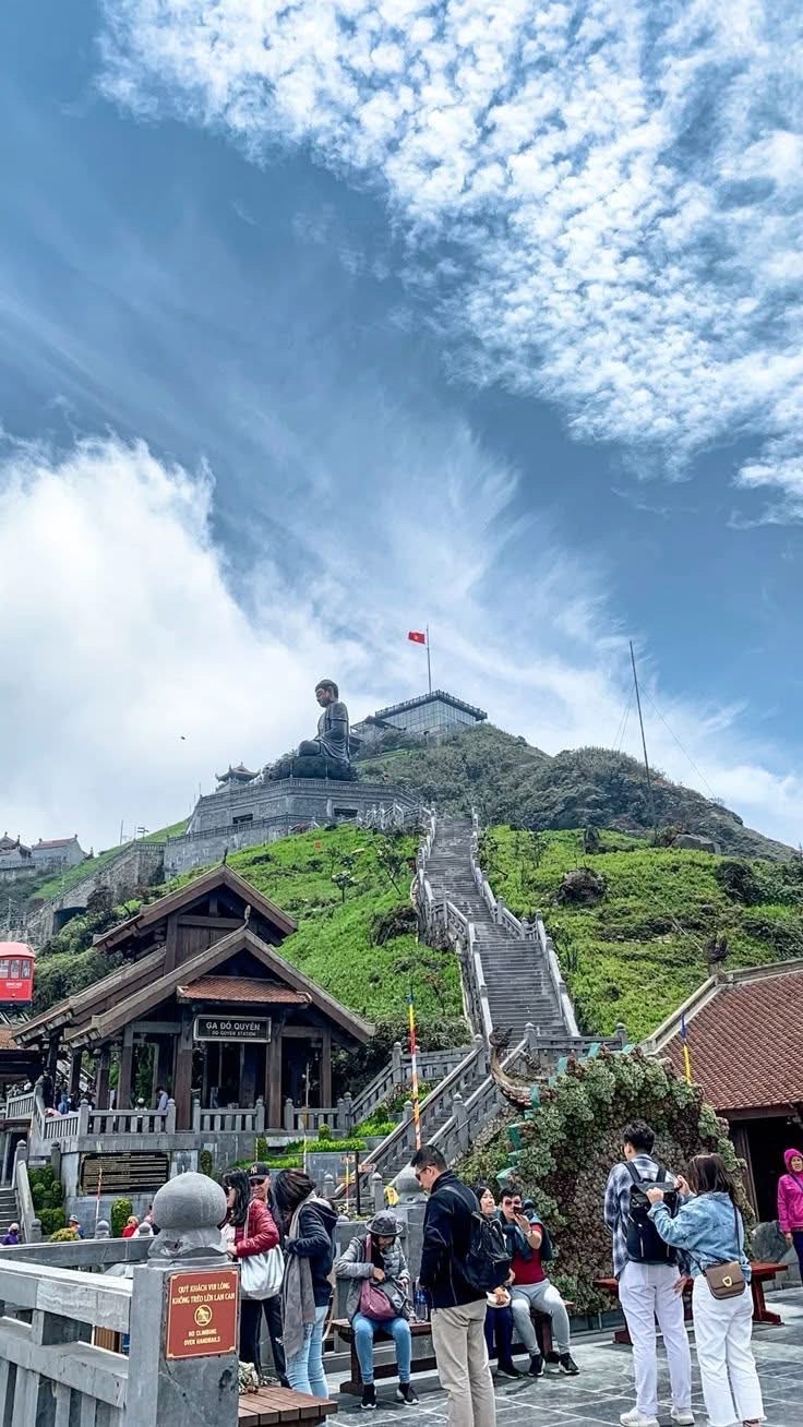 Fansipan summit in June — clouds and mist over the Hoang Lien Son range