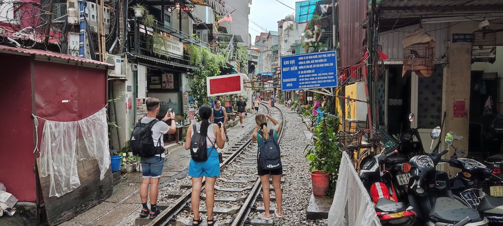 Train passing through Train Street in Hanoi Old Quarter