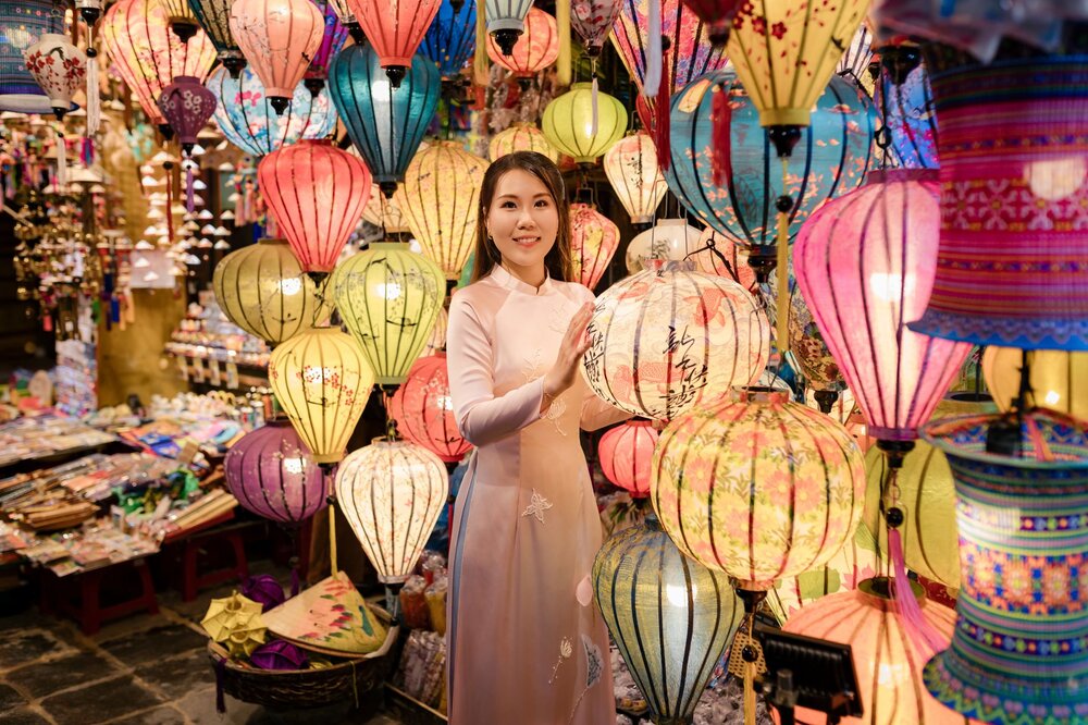 Hoi An ancient town at night with colourful lanterns reflecting on the river