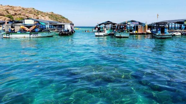 Floating fishing rafts and clear water at Hon Kho Island, Quy Nhon