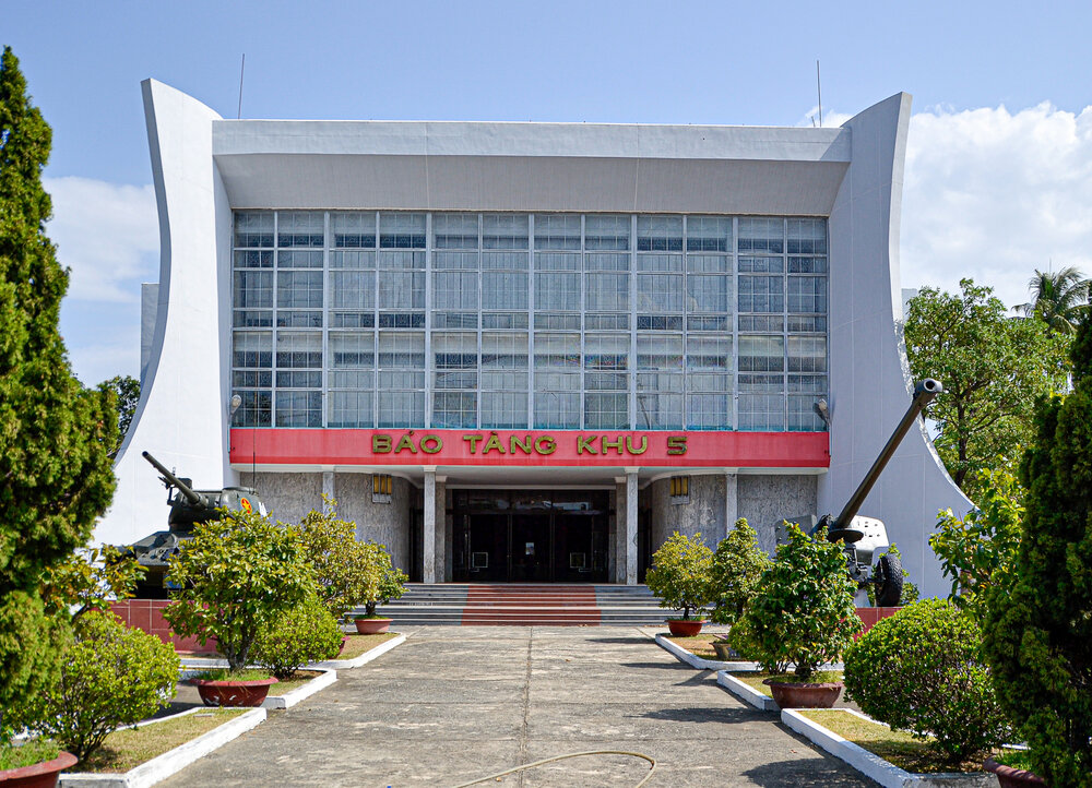 Outdoor military equipment display at the Museum of Military Zone 5 in Da Nang, featuring captured American tanks and aircraft