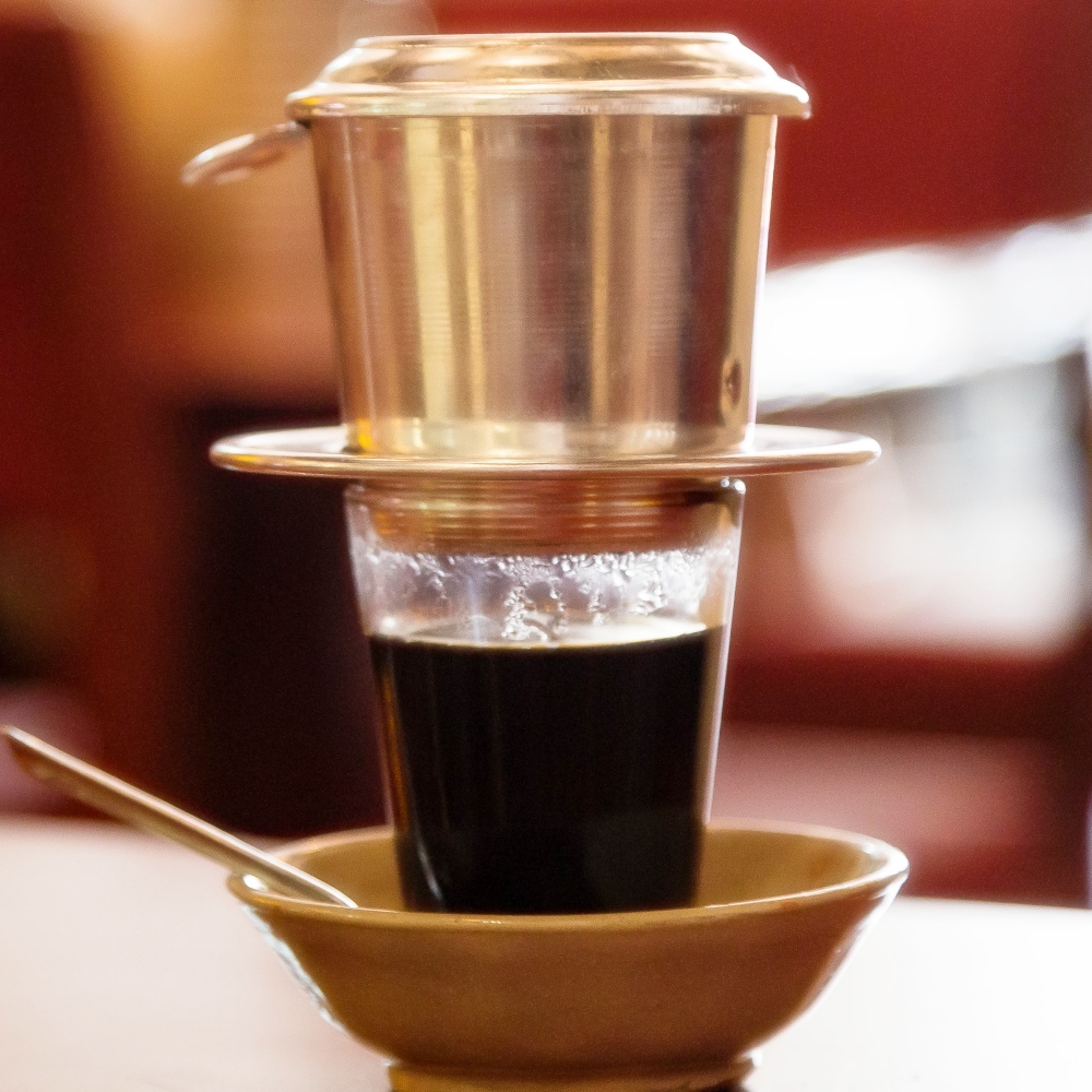 Vietnamese black coffee brewed through a phin filter
