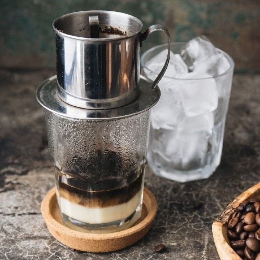 Glass of Vietnamese iced coffee with condensed milk and ice