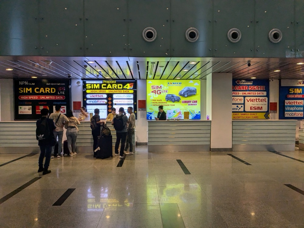 SIM card booths at Da Nang airport arrivals hall