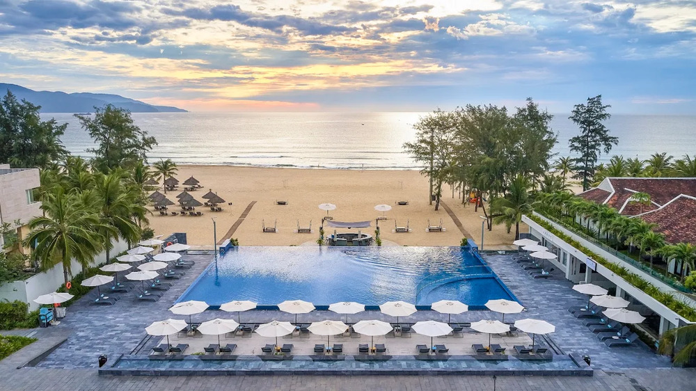Pullman Danang Beach Resort pool and beach area for families