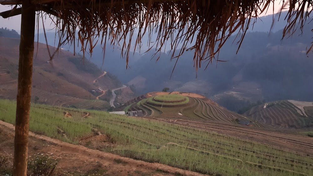 Mam Xoi Hill at dusk in March, its terraces bare before planting