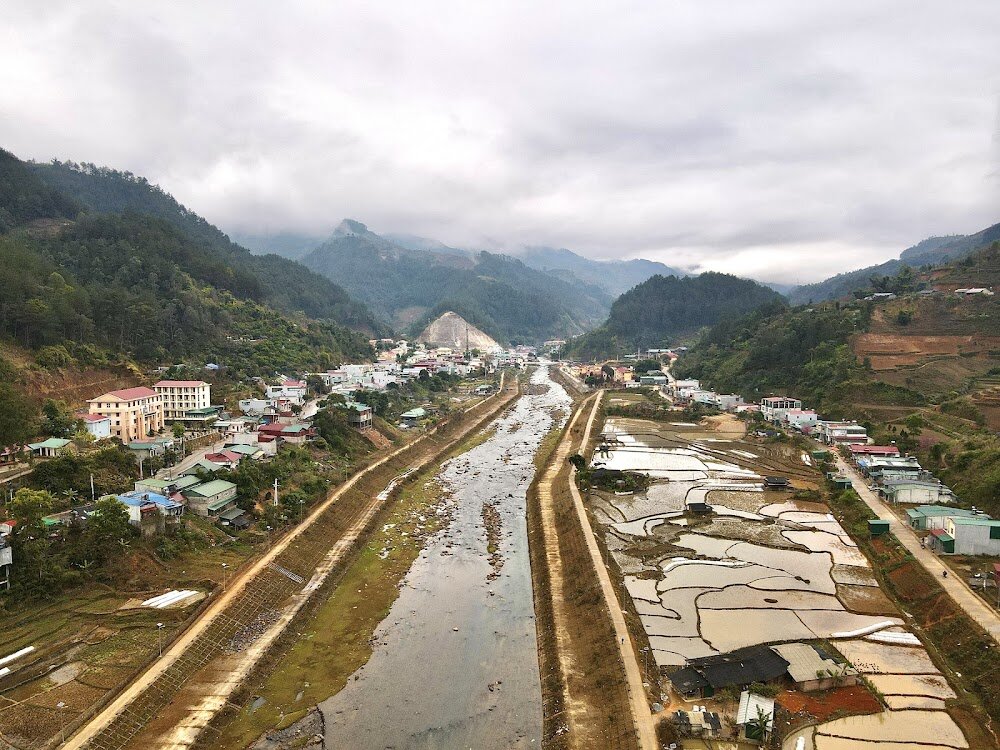 Mu Cang Chai town and its river valley under a grey January sky