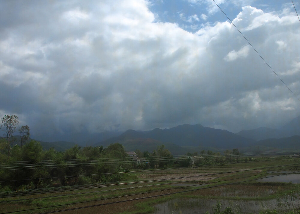 Vietnam coastal railway between Hue and Da Nang, with the South China Sea visible from the train window