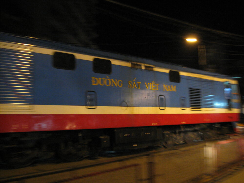 Vietnam Railways blue and red passenger carriage — Duong Sat Viet Nam at Hanoi station