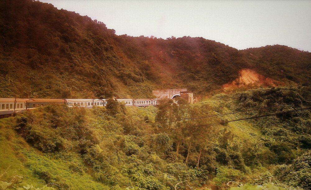 Reunification Express SE8 entering a mountain tunnel near Hai Van Pass between Da Nang and Hue