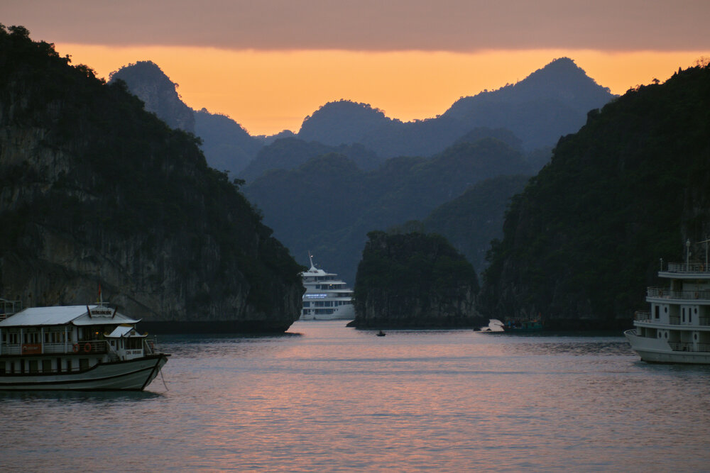 Traditional wooden junk boats on Ha Long Bay, Vietnam